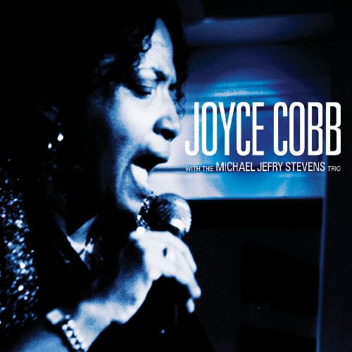 "CD cover featuring a woman singing into a microphone with text overlay."