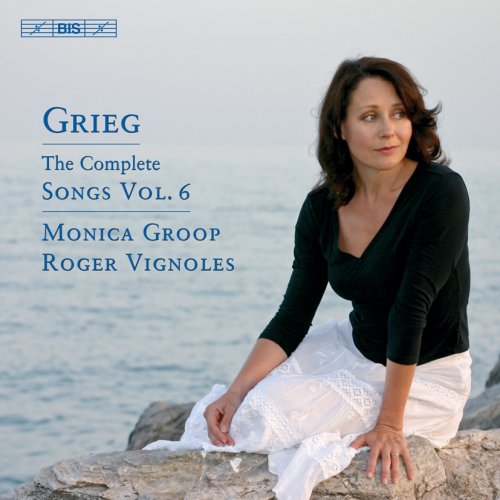 "CD cover with a woman sitting on rocks by water, wearing white skirt and black top."