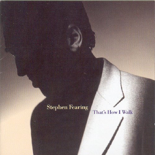 "Album cover featuring a man in a suit, partially in shadow, with text overlay."