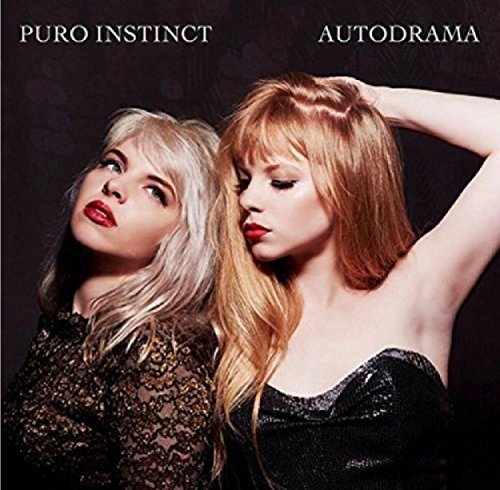 Album cover with two women, one blonde, one redhead, against a dark background.