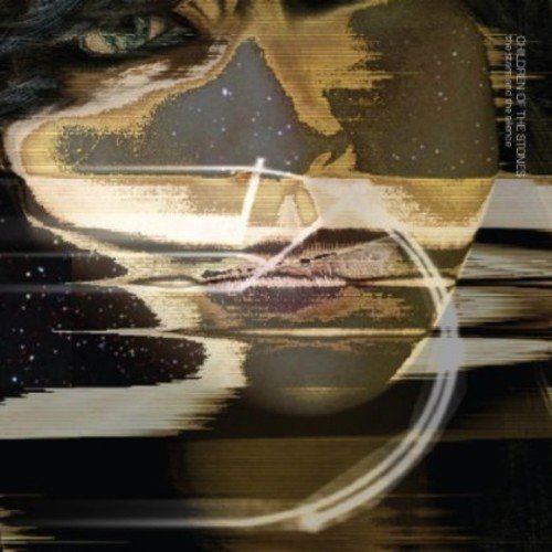 "Album cover with a close-up of a person's face and white circular design."