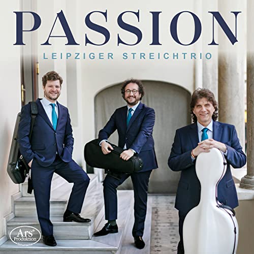 Three men in suits holding musical instrument cases stand on stone steps.