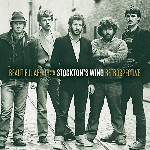 "Black and white vinyl album cover featuring five men standing on a cobblestone street."