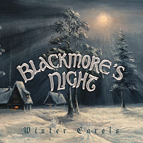 Blackmore’s Night “Winter Carols” album cover with snowy landscape and cabins.