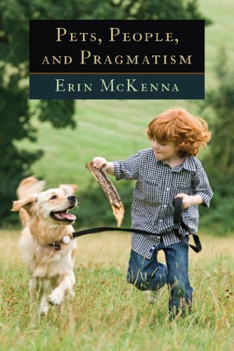 "Book cover showing a young boy playing with a dog in a grassy field."