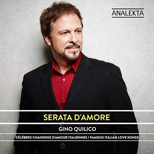 Man in black suit and red shirt, album cover with text overlay.