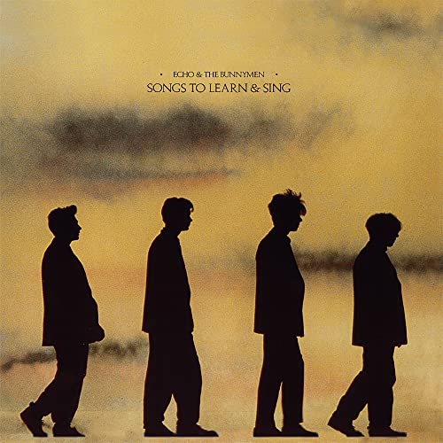 Album cover: silhouettes of four men walking against a yellow sky.