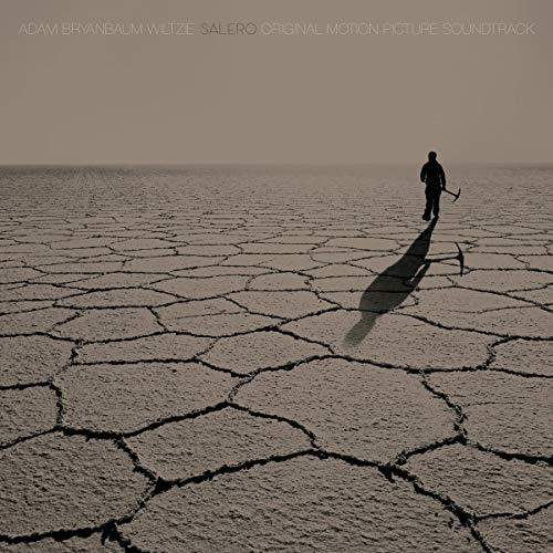 CD cover for "Salero" featuring a lone figure in a cracked landscape.
