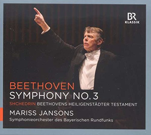 Conductor Mariss Jansons in a tuxedo, pointing, on a CD cover.