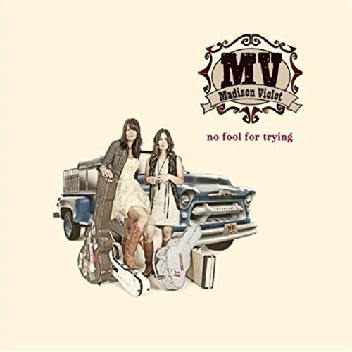 "Album cover featuring two women posing with guitars and a vintage truck."