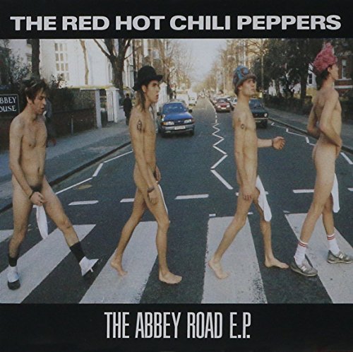 "Album cover featuring four naked men, parodying The Beatles, crossing a street."
