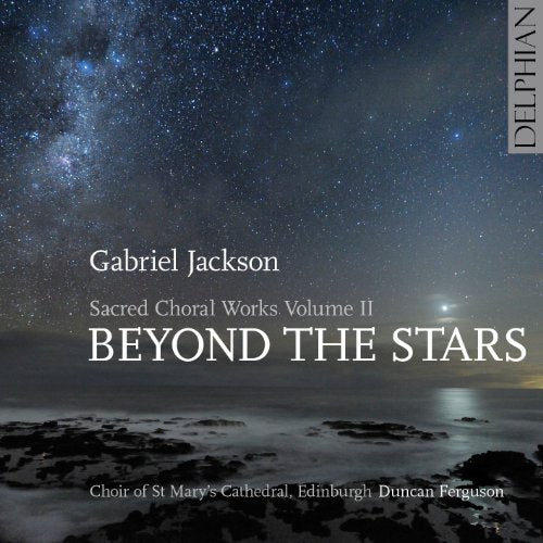 "Album cover with starry night sky over a rocky shoreline, white text."