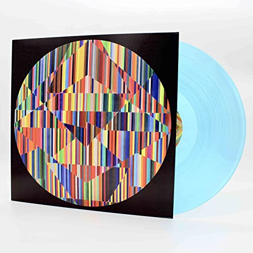 Turquoise vinyl record with colorful, geometric album cover art.