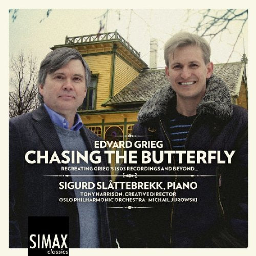 "CD cover featuring two men standing in front of a yellow house."