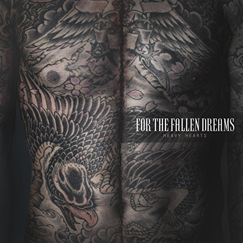 "CD album cover with tattooed back and text 'For the Fallen Dreams - Heavy Hearts'."