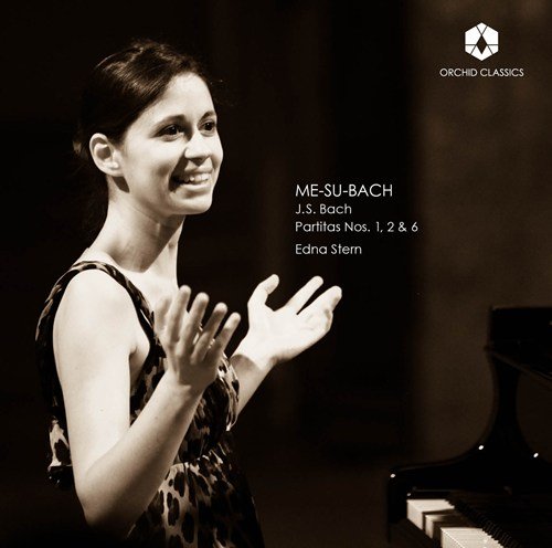 "CD cover with a woman standing beside a piano, wearing a leopard print dress."