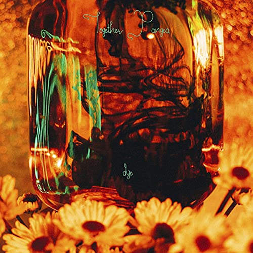 CD cover with swirling colors inside a glass jar, surrounded by flowers.