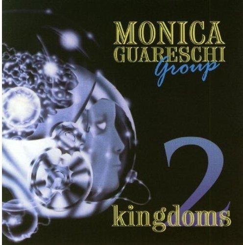 "CD cover art with a woman's face in a sphere, surrounded by swirling orbs."