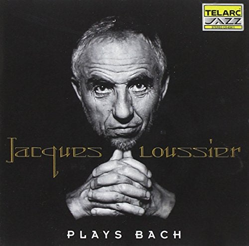 "CD cover featuring a black-and-white portrait of Jacques Loussier with clasped hands."