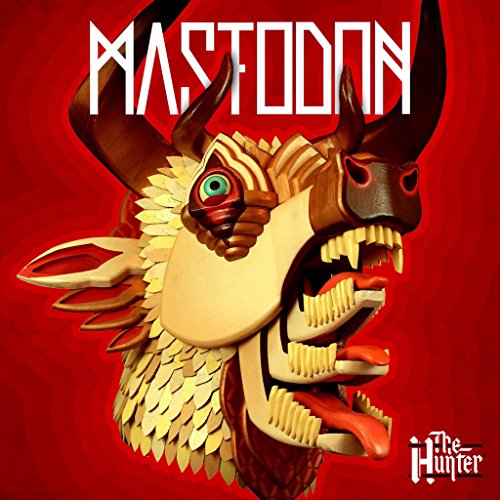 Vinyl album cover featuring a fantastical, multi-headed creature with sharp teeth and horns.