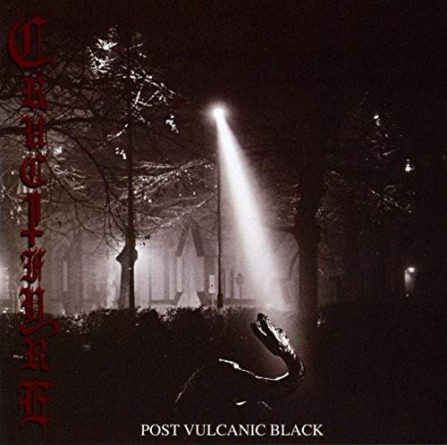 Dark album cover with a desolate landscape and red band name.