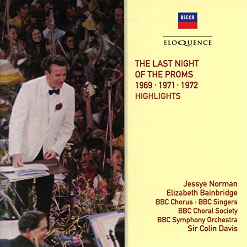 Conductor in white tuxedo on CD cover with yellow background and red text.