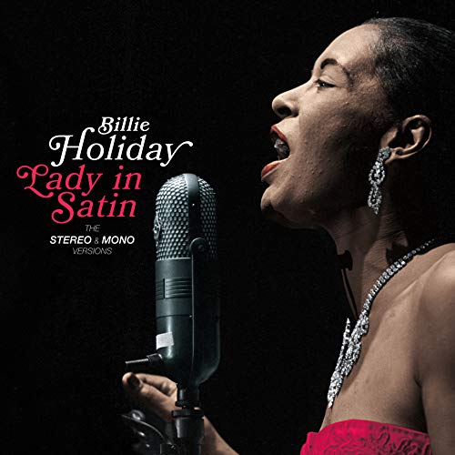 Billie Holiday singing into a vintage microphone, album cover.