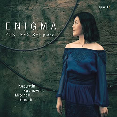 CD cover for Yuki Negishi's "Enigma" featuring a portrait of the pianist.