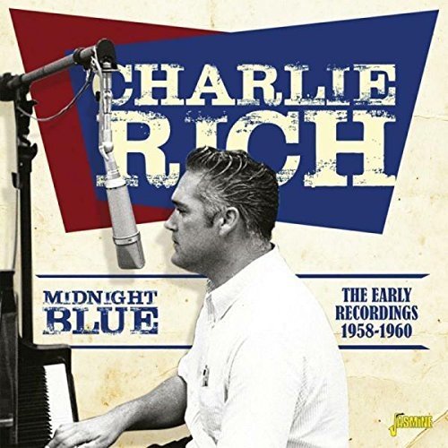 "Album cover featuring Charlie Rich at a microphone, playing piano, with title text."
