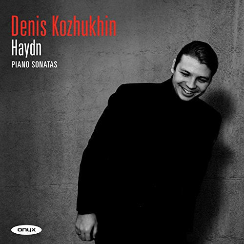 Album cover featuring pianist Denis Kozhukhin smiling against a grey textured wall.