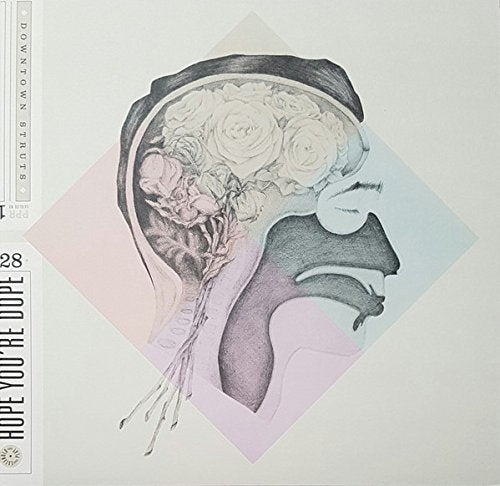 Album cover: floral brain illustration within a profile silhouette.