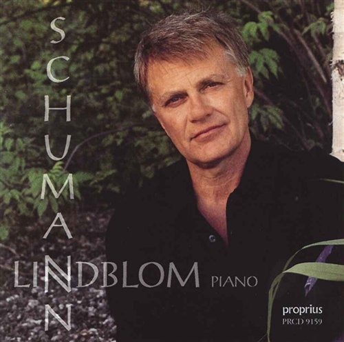 "CD cover with a man in black shirt against a leafy background."
