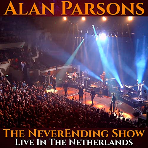 Alan Parsons concert stage with band performing to a large, crowded audience.