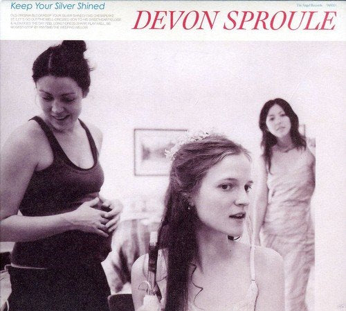 "Album cover with three women, one wearing a tiara, in black and white."