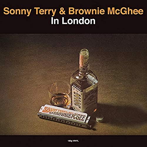 Vinyl album cover featuring a bottle of whiskey, a glass, and a harmonica.