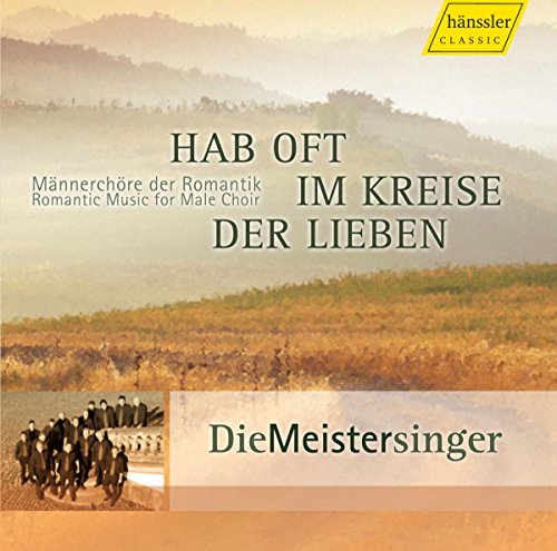 "CD cover with misty landscape, text, and a small image of men in suits."