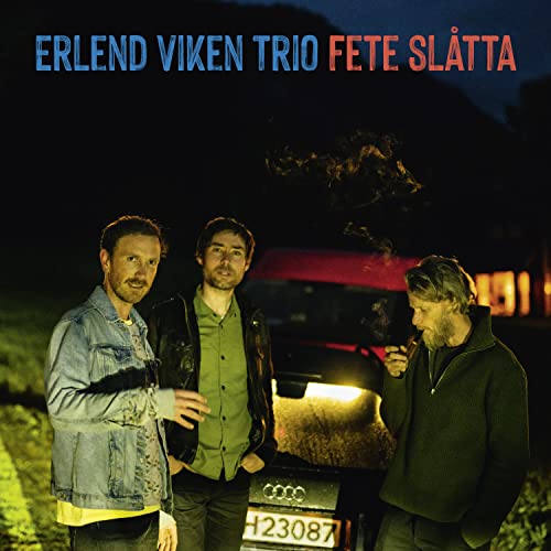 CD cover featuring three men standing near a car at dusk.