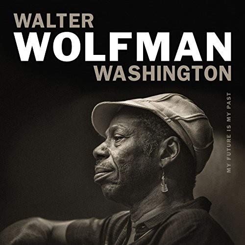 Album cover with black background, featuring a man wearing a cap.