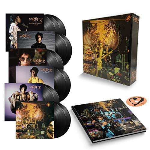 "Prince vinyl record box set with five records, booklet, and a heart-shaped sticker."