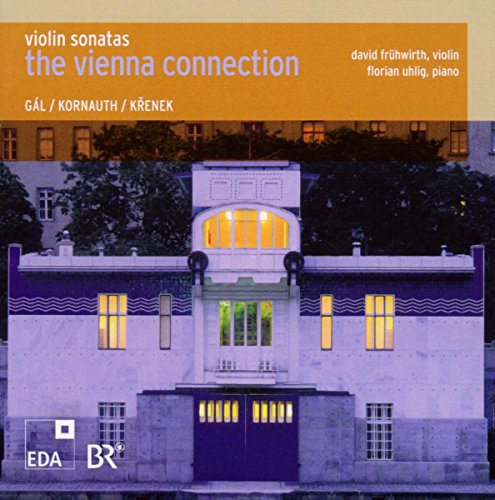 "CD cover featuring a building at dusk with lit windows and a purple tint."