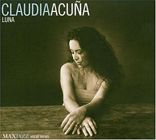 Sepia-toned album cover with woman resting arms on a table, curly hair.