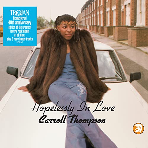 CD cover: Carroll Thompson poses with a car, wearing a fur coat.