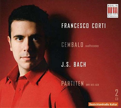 The image shows a man in a red shirt on a red background with white text. Here is a concise alt text: Man in red shirt on red background with white text.