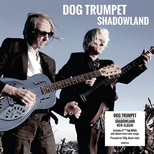 Album cover for Dog Trumpet’s “Shadowland” featuring two musicians with guitars.
