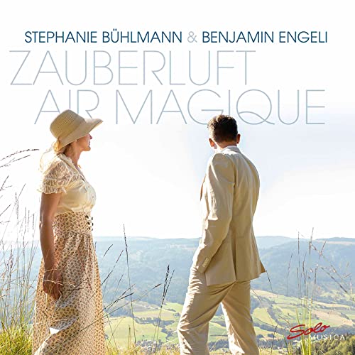 CD cover with a couple walking in a grassy field landscape.