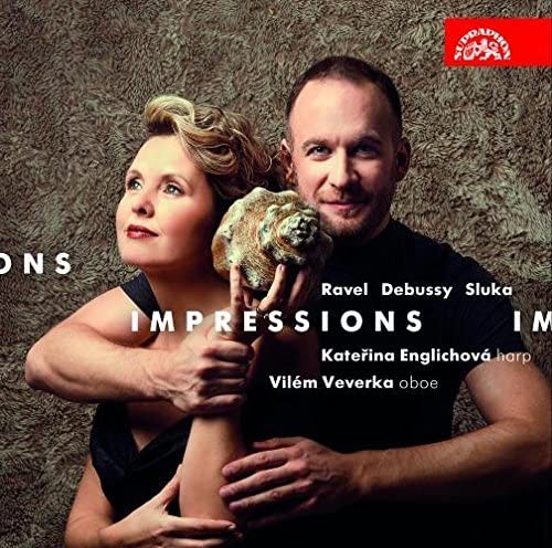 CD cover featuring a woman and man with a sculpted head, text “Impressions.”