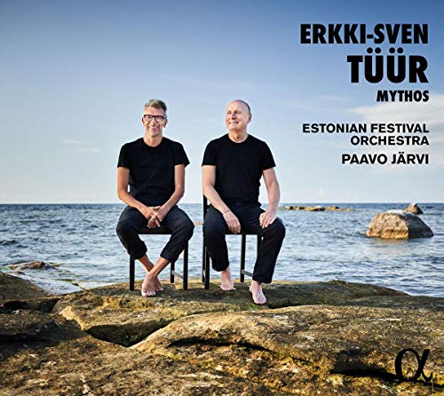 "CD cover with two men sitting on stools on a rocky shoreline."