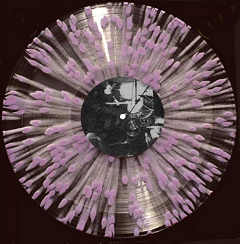 Clear vinyl record with pink cotton buds on a black background.