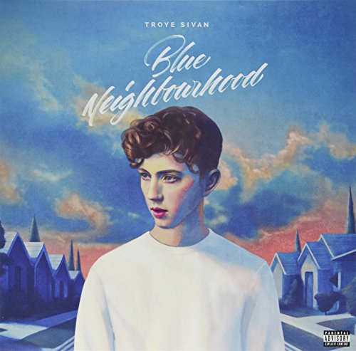 Troye Sivan album cover: portrait against a blue, cloudy, suburban backdrop.
