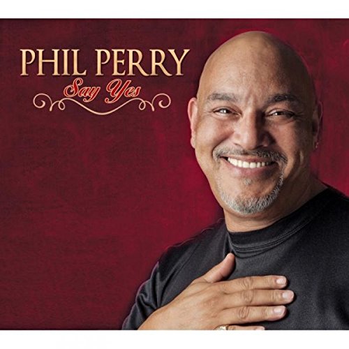 "Album cover with Phil Perry smiling, against a red background, with 'Say Yes' text."